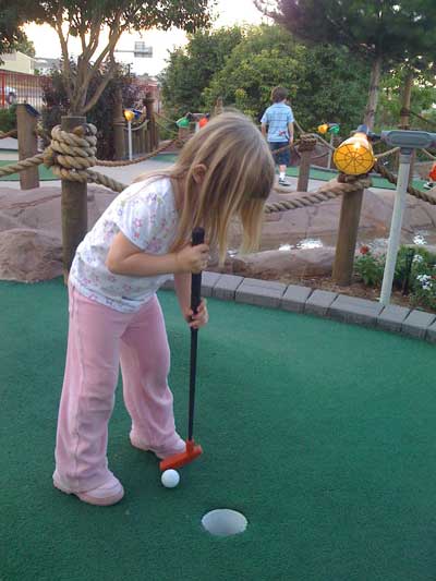 Adrianna playing mini-golf