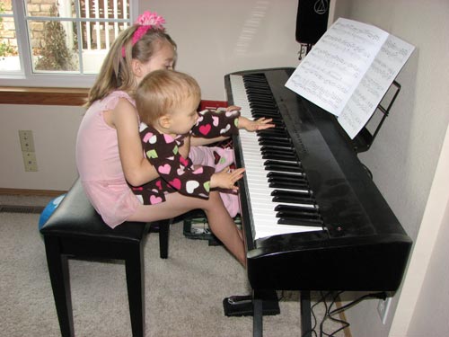 Adrianna and Bree play the piano
